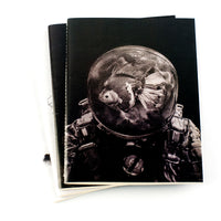 Kevin Roque's Quaderno notebooks stack with Odisea notebook on top