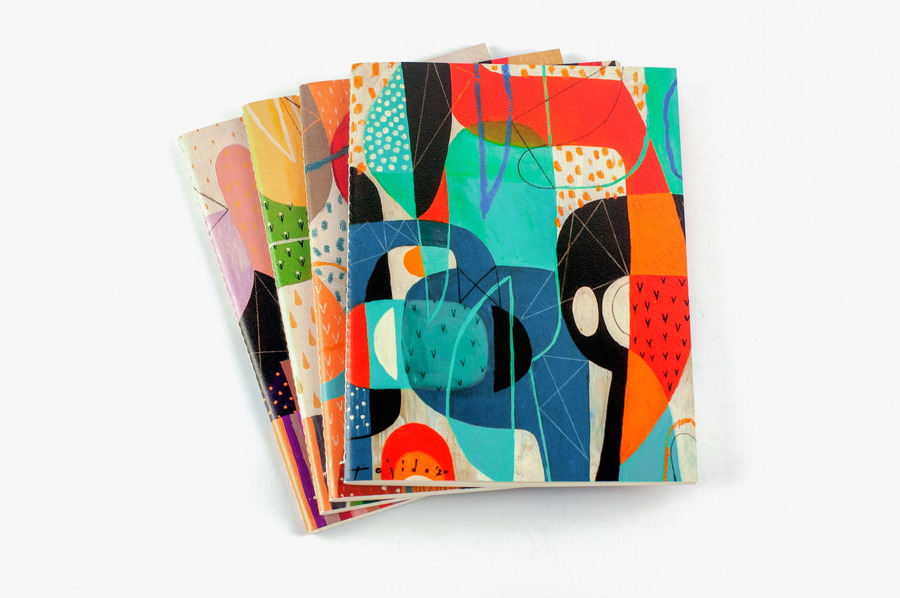 Quaderno notebooks stack by Jomike Tejido with Renewed Lifestyle on top