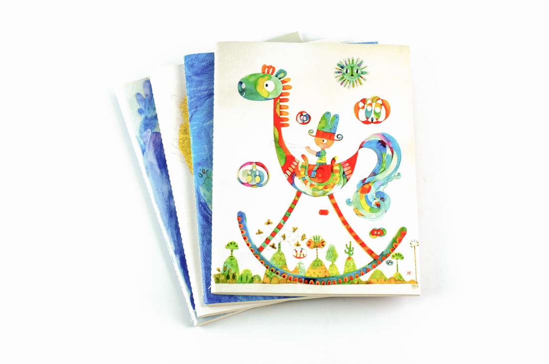 Beth Parrocha's Quaderno notebooks stack with Rocking Horse on top